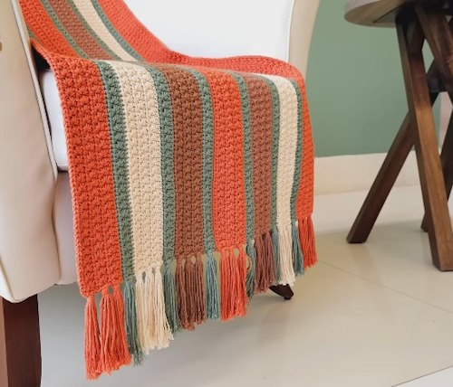 Fantasy stitch crochet blanket styled on sofa