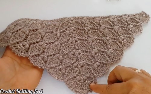  Diagonal view of crochet triangle shawl with puff stitch