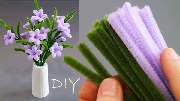DIY Pipe Cleaner Starflowers displayed in a mini vase with crafting materials