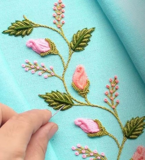 Easy hand embroidery patterns-Finished floral hand embroidery with rosebuds and green leaves