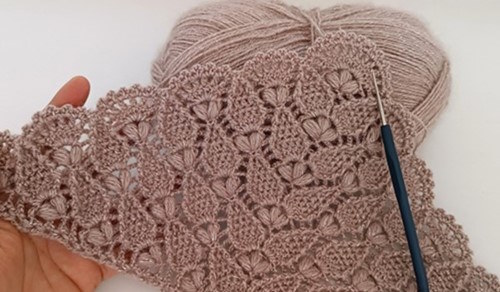 Completed puff stitch triangular shawl with fan motif