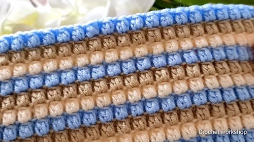 Finished easy crochet baby blanket with pastel tones